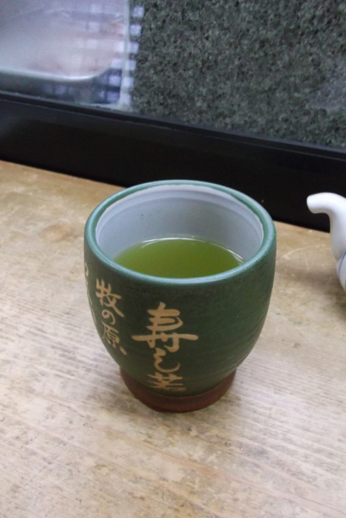 Green tea served with menu.
