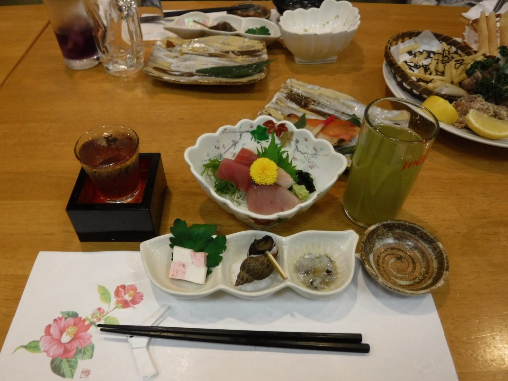 Japanese cuisine with green tea cacktail ( Shochu, Japanese distilled spirit brended with Sencha green tea ), served in Japanese bar.