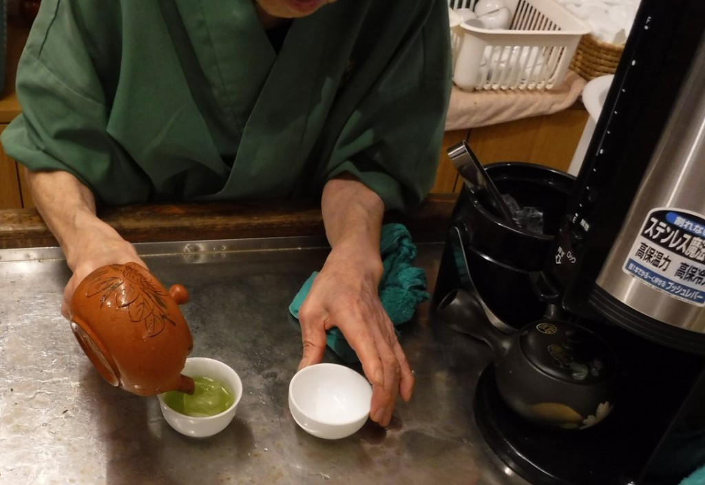 10 Staff serves green tea in Narusawa